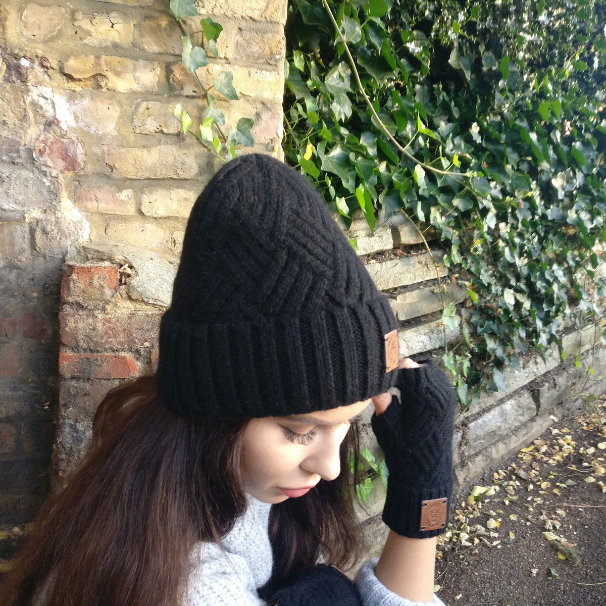 Women’s black cashmere knit beanie and matching gloves